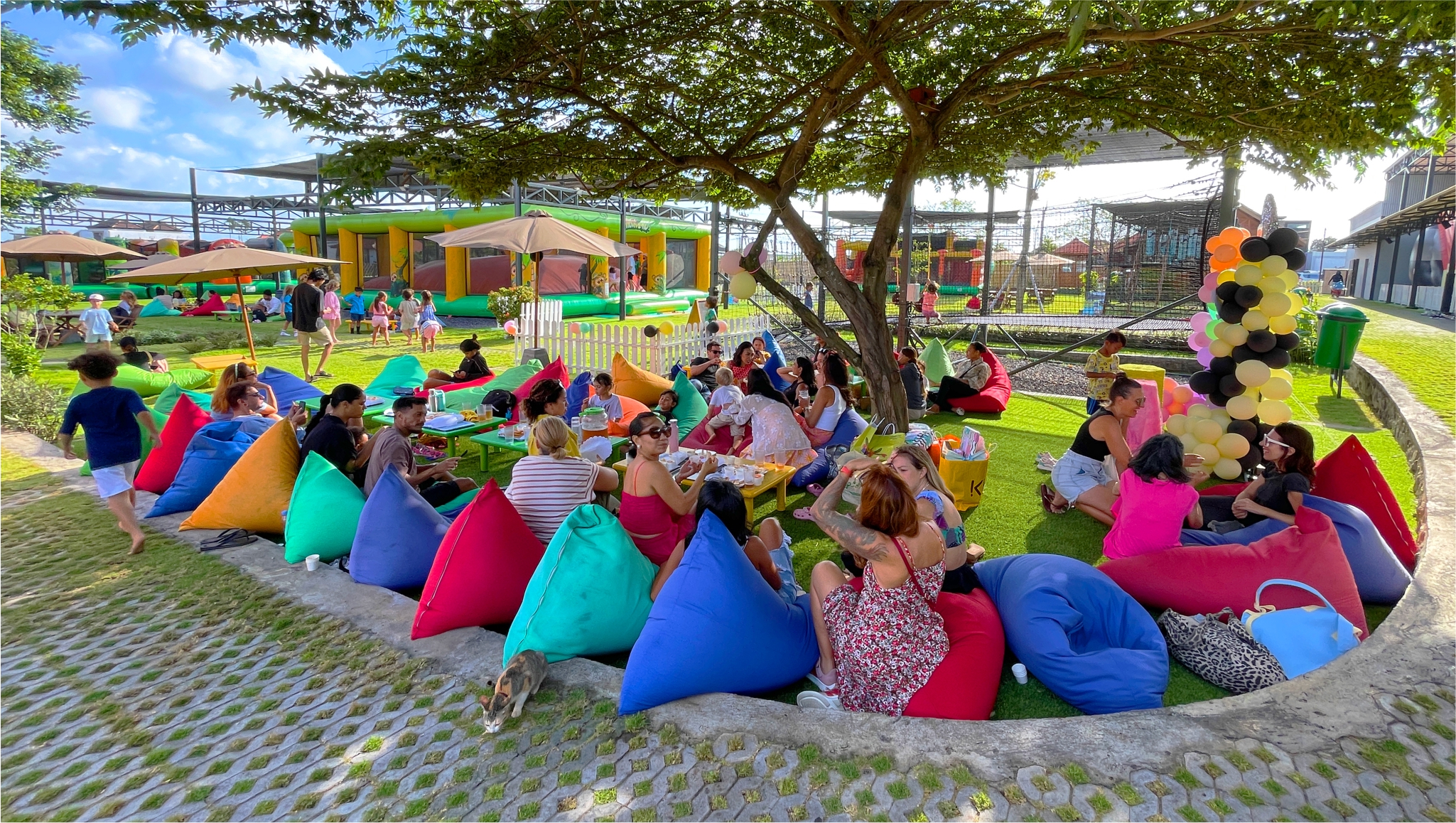 Shaded green outdoor playground Bali Mookiland rice field views trees