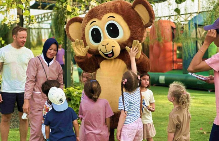 Kids playing at Mookiland Park Bali with the mascot Mooki.