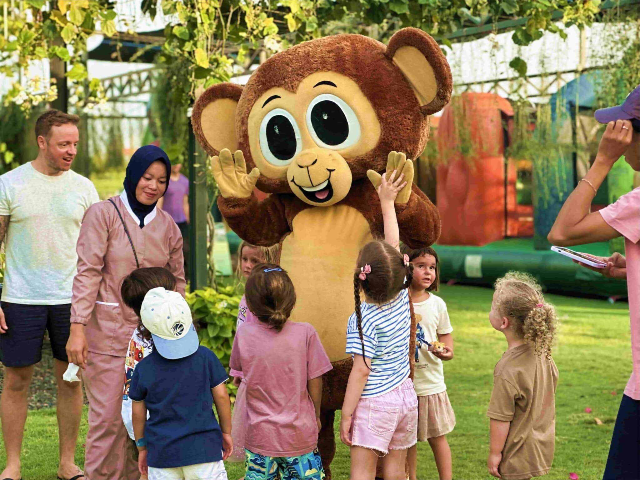Kids playing at Mookiland Park Bali with the mascot Mooki.